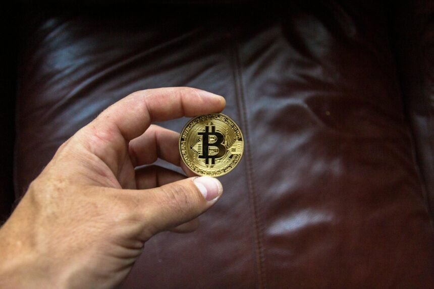 holding bitcoin in your hand