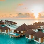maldives island with huts in water