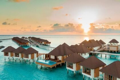 maldives island with huts in water